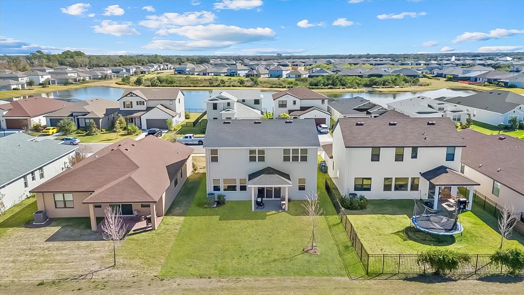 8330 Abalone Loop Palmetto, FL 34221 - Photo 42 of 45 an aerial view of a house with a big yard