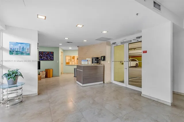 a view of a livingroom with furniture and an empty room