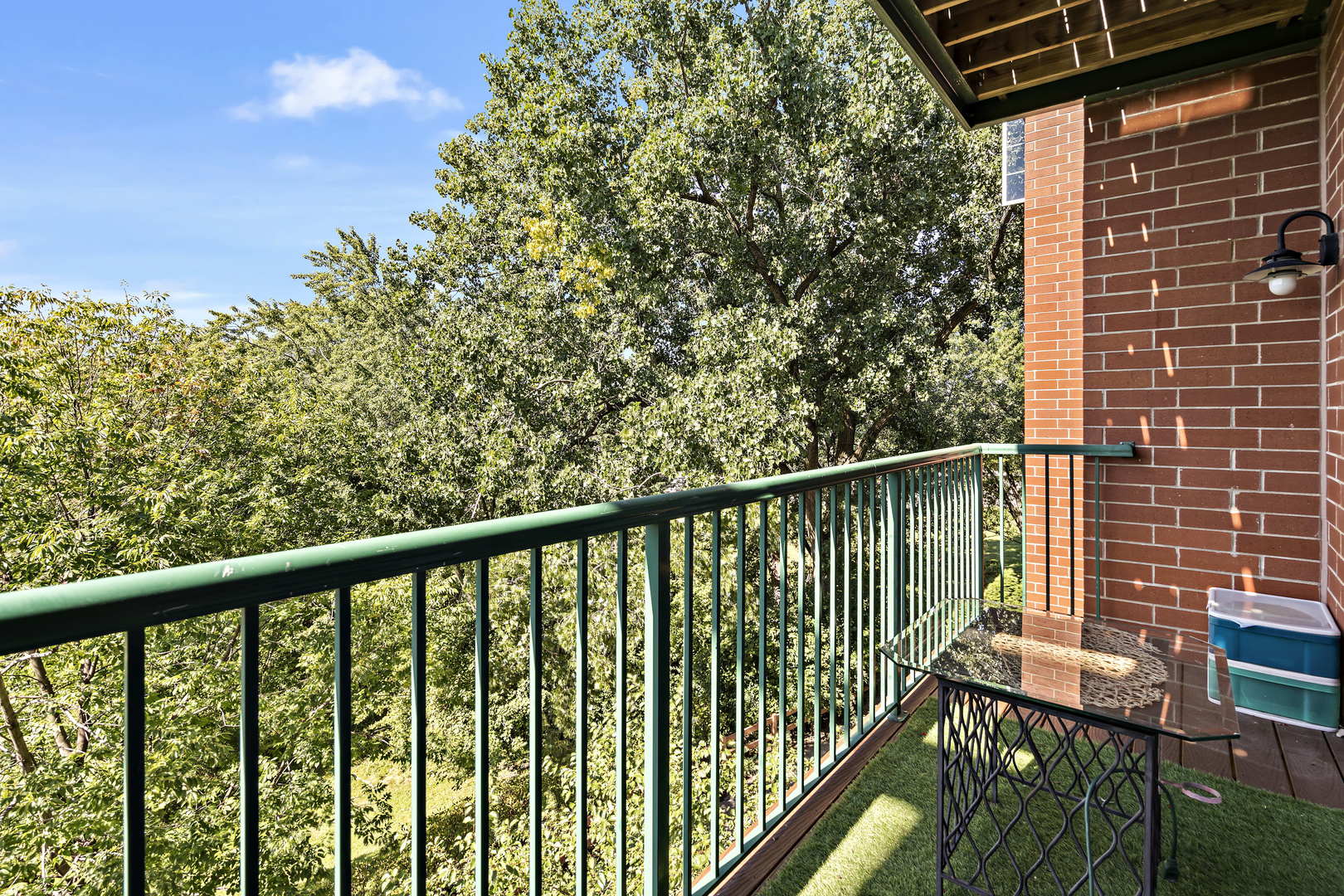 660 McHenry Road, Unit 306 Wheeling, IL 60090 - Photo 16 of 17 a view of a balcony with wooden floor and fence