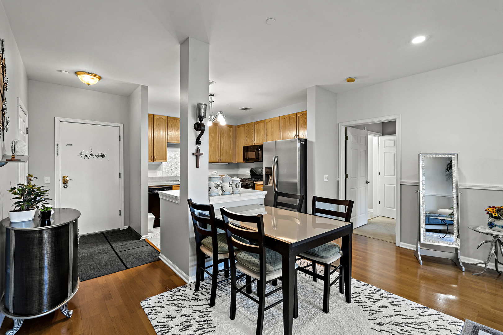 660 McHenry Road, Unit 306 Wheeling, IL 60090 - Photo 5 of 17 a view of a dining room with furniture