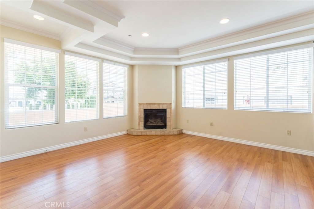 511 East Harvard Road, Unit 101 Burbank, CA 91501 - Photo 7 of 29 a view of an empty room with wooden floor and a window