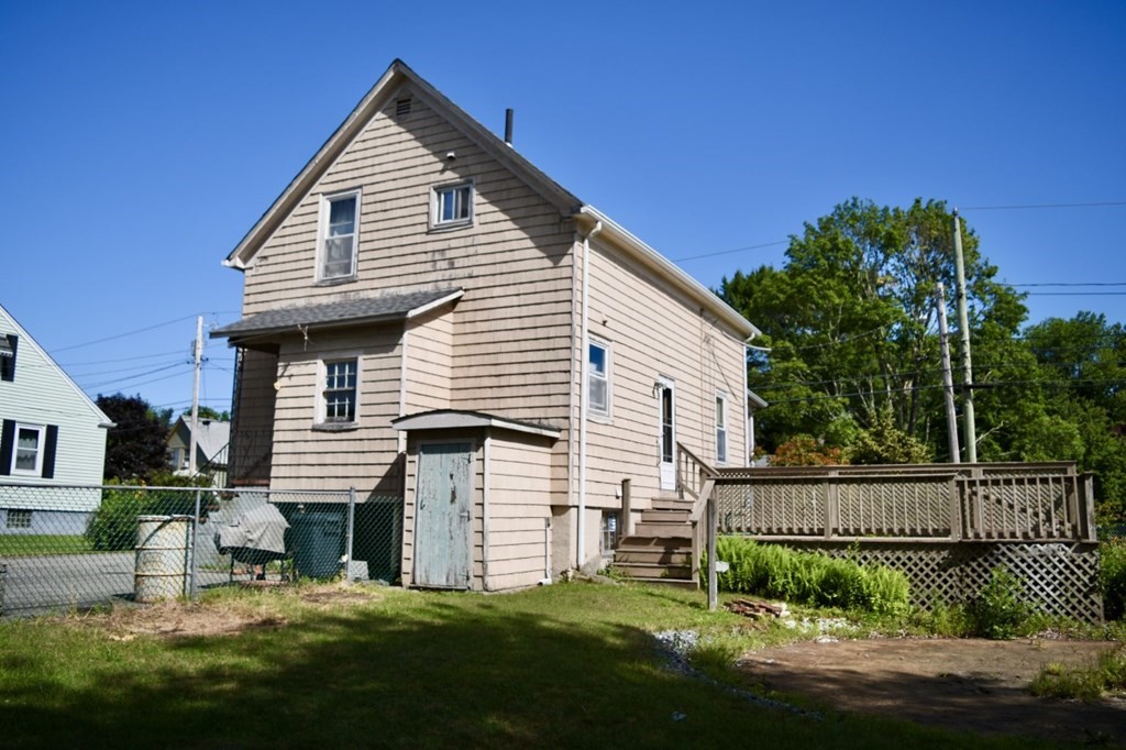 113 Howland Road Fairhaven, MA 02719 - Photo 2 of 13 a view of a house with a yard