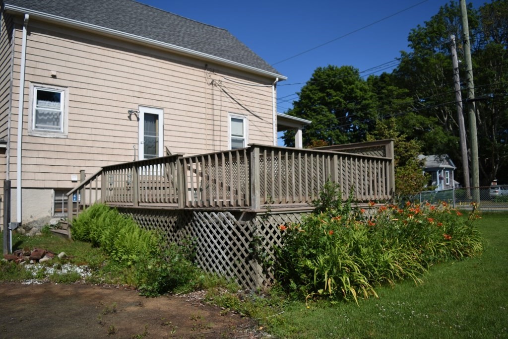 113 Howland Road Fairhaven, MA 02719 - Photo 3 of 13 a view of a house with a fence