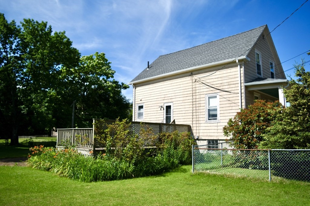 113 Howland Road Fairhaven, MA 02719 - Photo 4 of 13 a view of a house with a yard