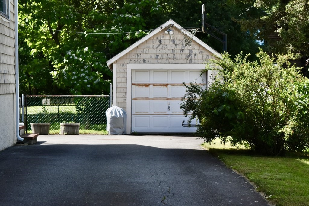 113 Howland Road Fairhaven, MA 02719 - Photo 5 of 13 a view of backyard with a barn and a cactus plant