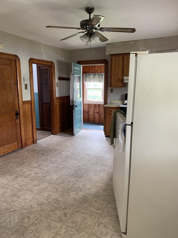 113 Howland Road Fairhaven, MA 02719 - Photo 7 of 13 a view of a hallway with a chandelier