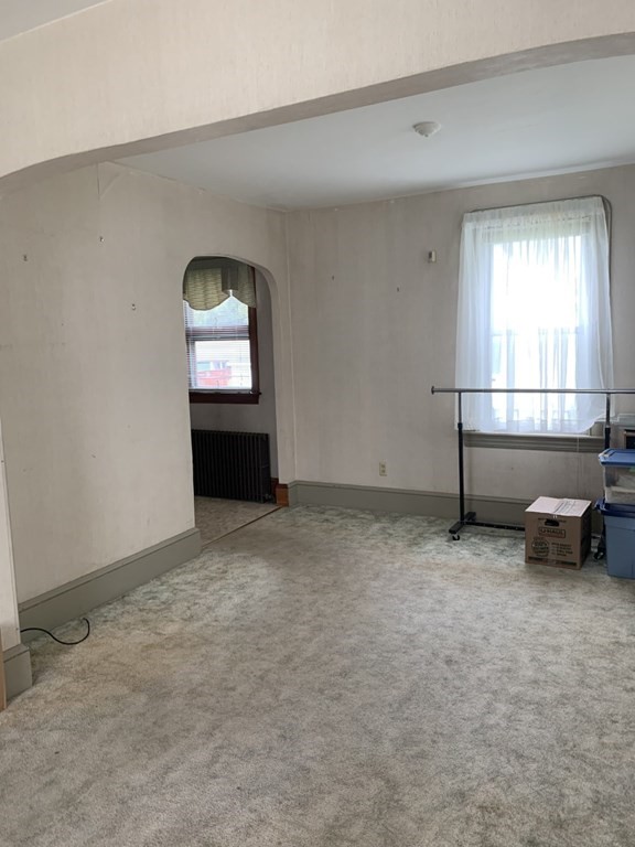 113 Howland Road Fairhaven, MA 02719 - Photo 8 of 13 an empty room with a window