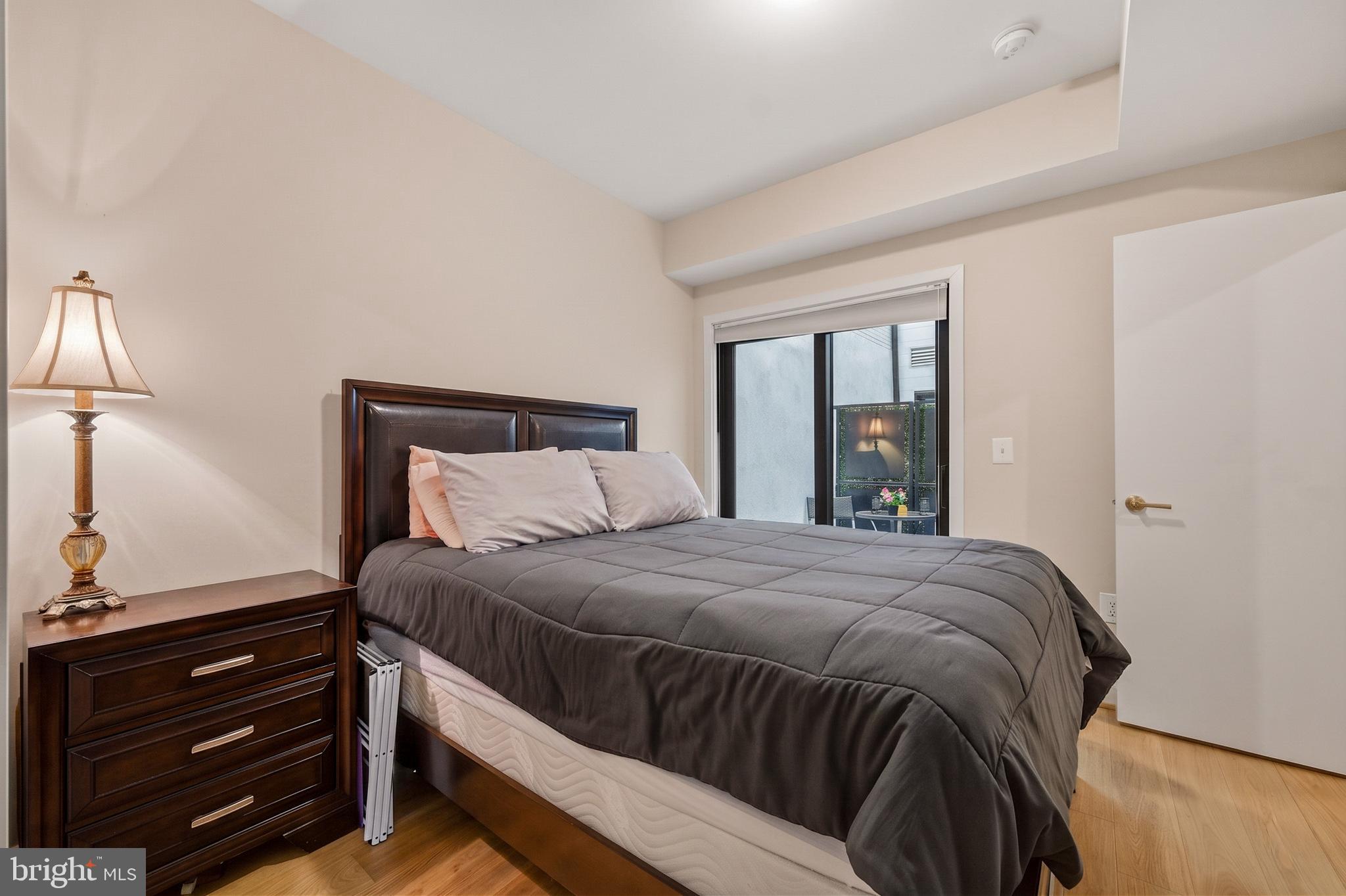 1402 12th Street Northwest, Unit 3 Washington, DC 20005 - Photo 17 of 23 a bedroom with a bed and a window