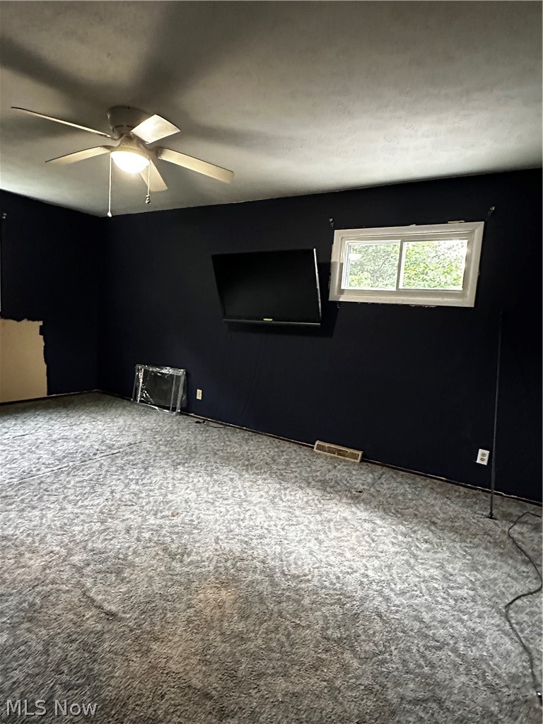 198 Park Road Painesville, OH 44077 - Photo 23 of 31 Room featuring dark wall paint, patterned carpet, and a white ceiling