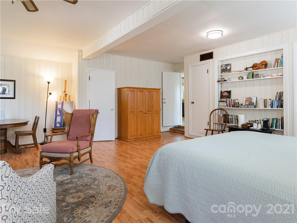 298 Erwin Hills Road Asheville, NC 28806 - Photo 19 of 48 a bedroom with furniture and a bed