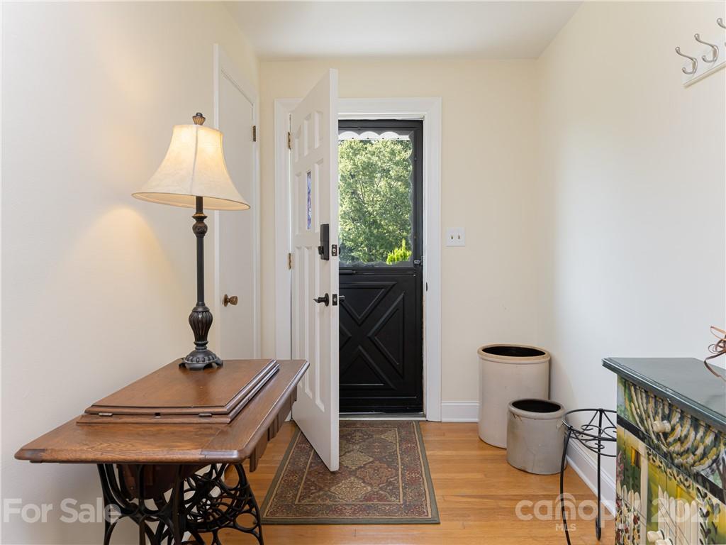 298 Erwin Hills Road Asheville, NC 28806 - Photo 3 of 48 a room with furniture and a window