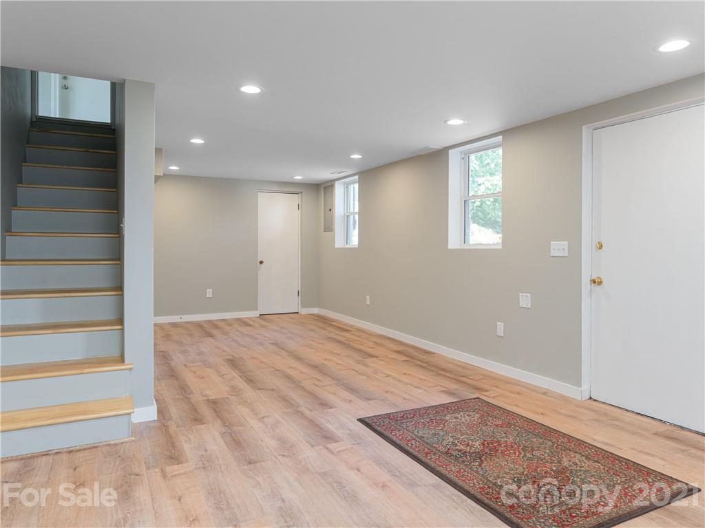 298 Erwin Hills Road Asheville, NC 28806 - Photo 22 of 48 a view of an empty room with a window