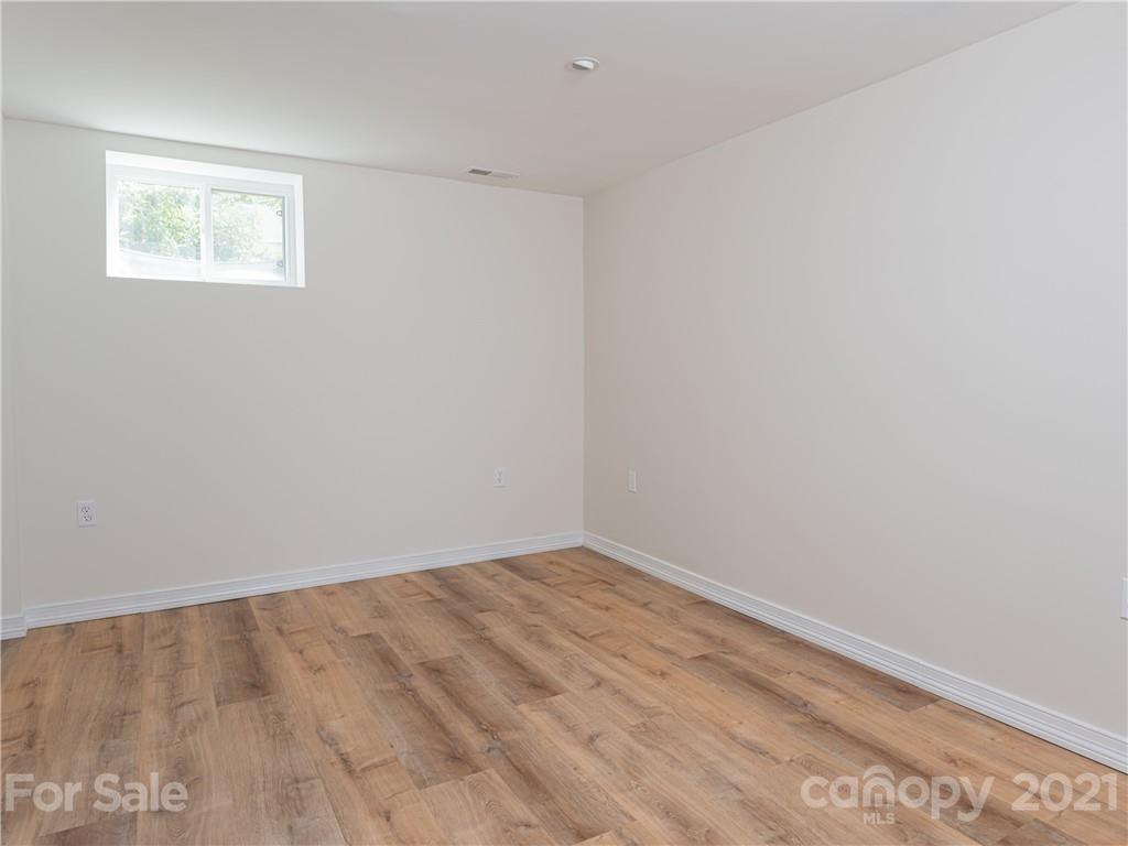 298 Erwin Hills Road Asheville, NC 28806 - Photo 29 of 48 an empty room with a empty space