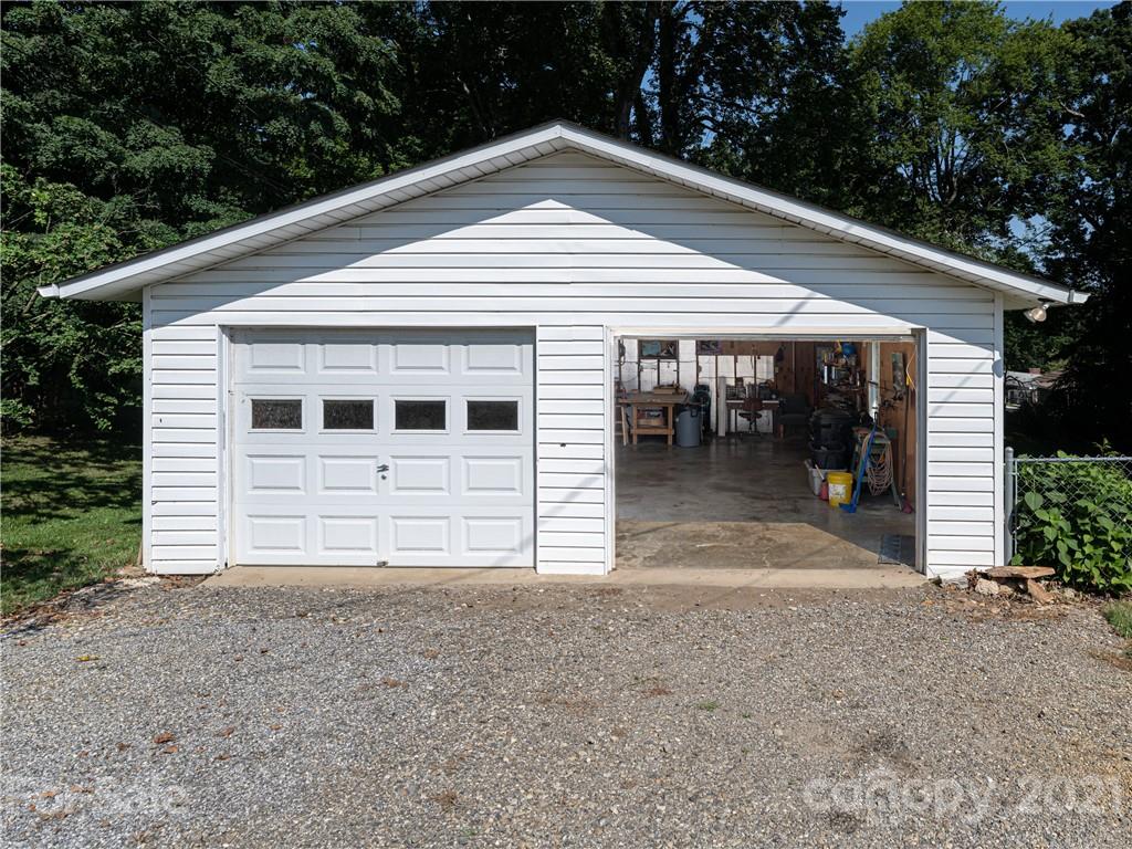 298 Erwin Hills Road Asheville, NC 28806 - Photo 37 of 48 a view of a house with a yard and garage