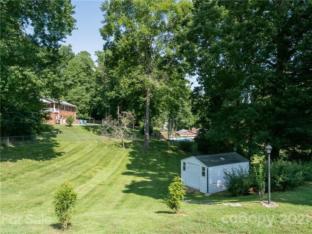 298 Erwin Hills Road Asheville, NC 28806 - Photo 40 of 48 a garden view with a sitting space