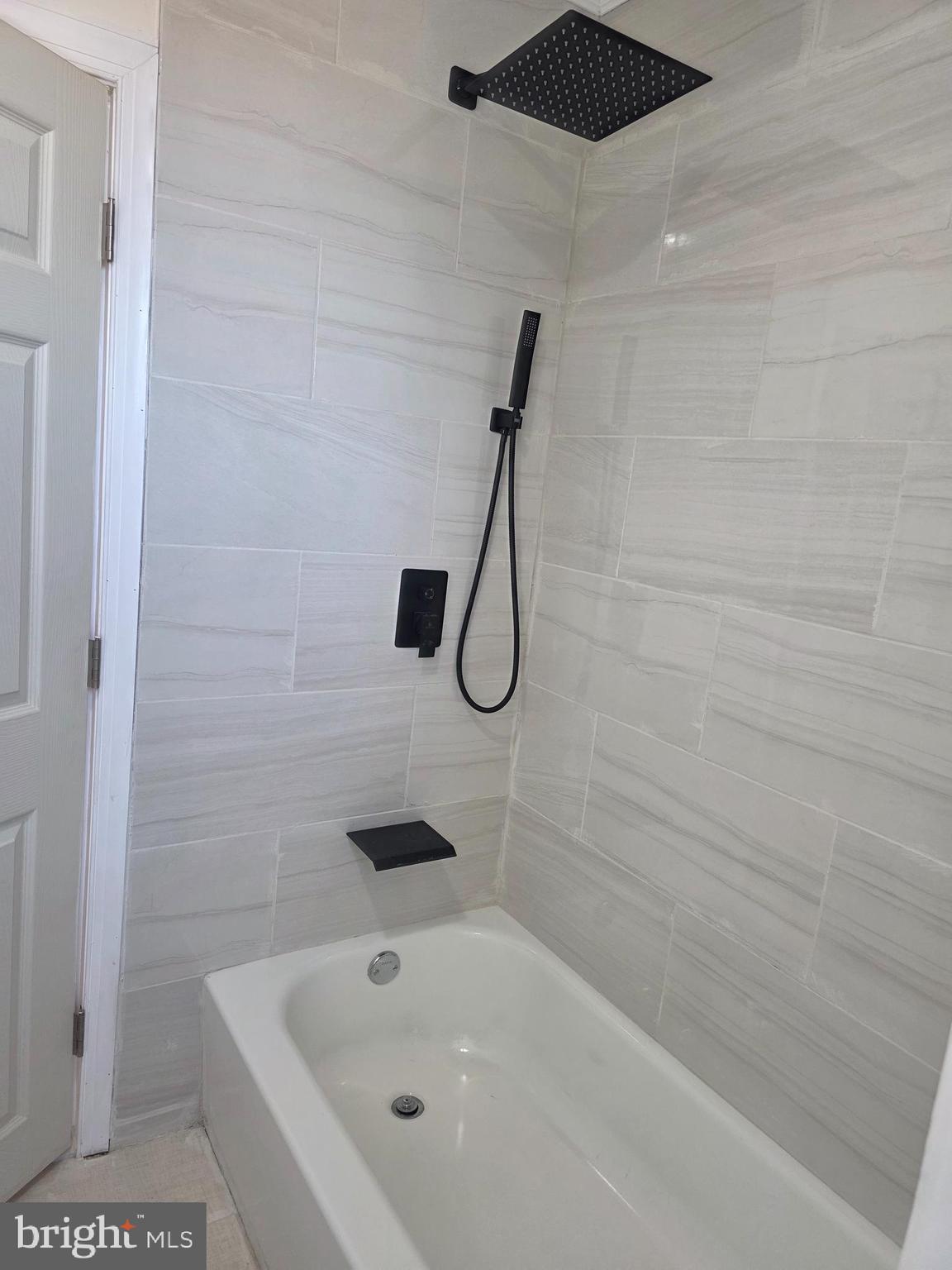 5901 Belmar Street, Unit 3 Philadelphia, PA 19143 - Photo 8 of 10 a bathroom with a bathtub