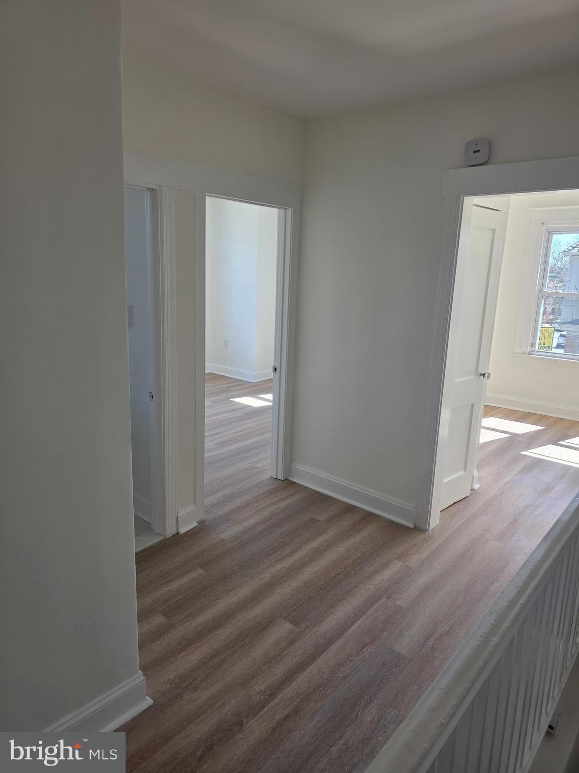 5901 Belmar Street, Unit 3 Philadelphia, PA 19143 - Photo 10 of 10 a view of a hallway with wooden floor