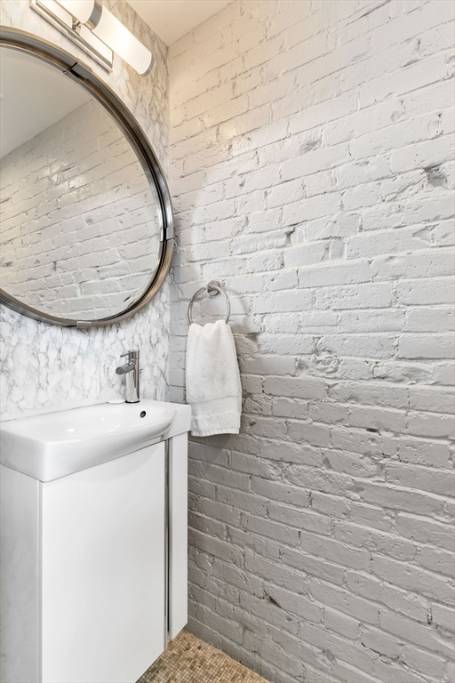 53 Snow Hill Street Boston, MA 02113 - Photo 12 of 35 a bathroom with a sink and a mirror