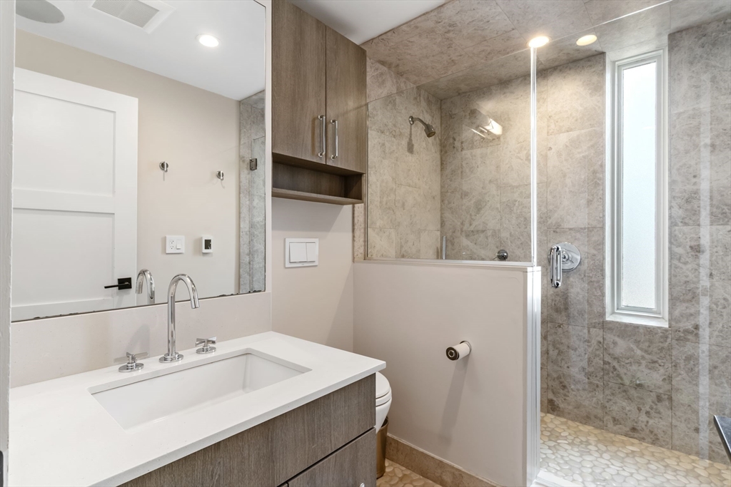 53 Snow Hill Street Boston, MA 02113 - Photo 15 of 35 a bathroom with a sink and a mirror