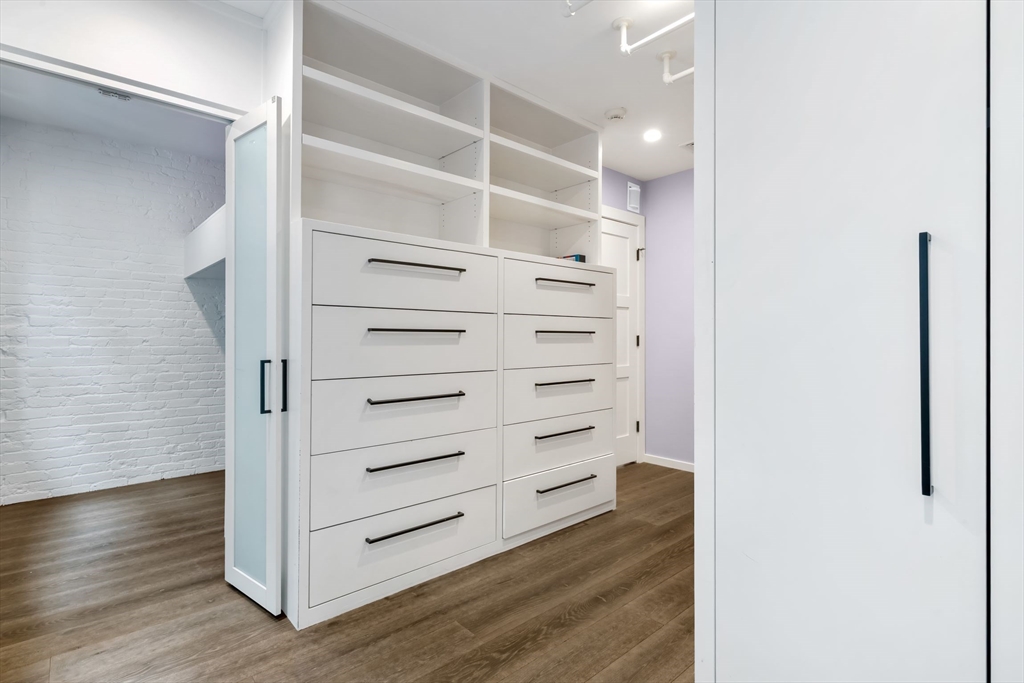 53 Snow Hill Street Boston, MA 02113 - Photo 20 of 35 a view of walk in closet with empty racks
