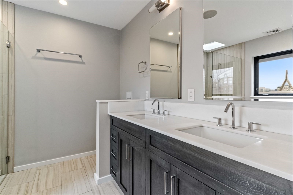 53 Snow Hill Street Boston, MA 02113 - Photo 29 of 35 a bathroom with a sink and a mirror