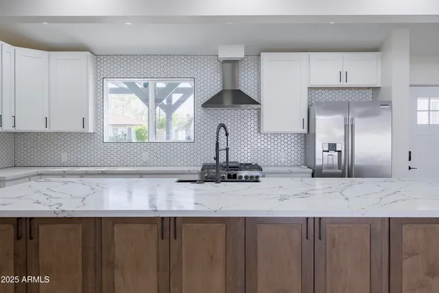 a kitchen with a sink and cabinets