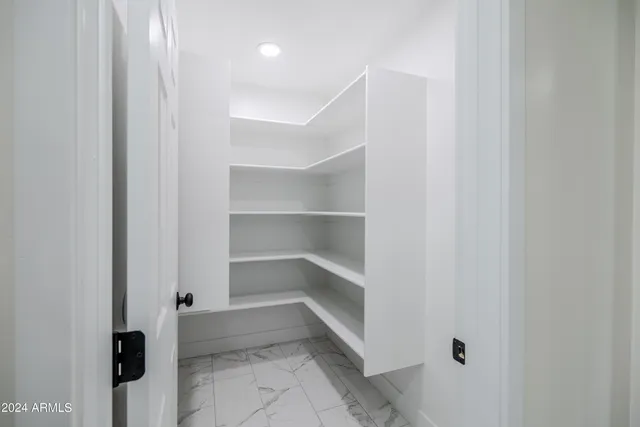 a view of a hallway with shelf
