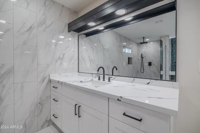 a bathroom with a sink and a mirror