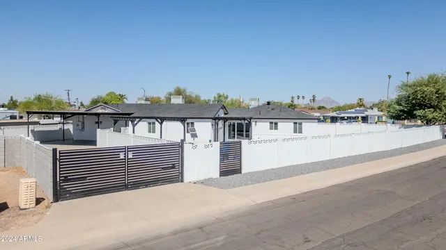 a terrace of a house with wooden fence