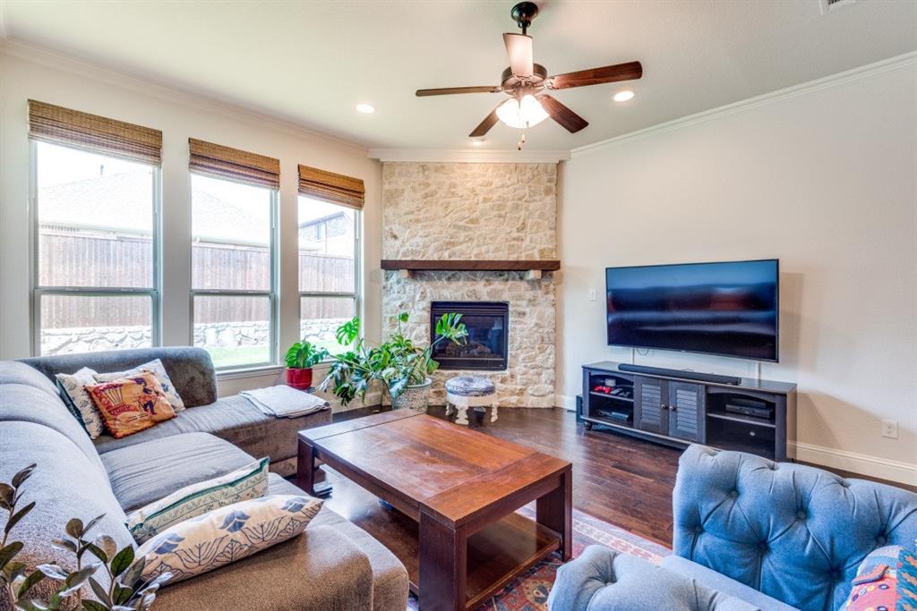 2364 Mare Road Carrollton, TX 75010 - Photo 10 of 25 a living room with furniture a flat screen tv and a large window