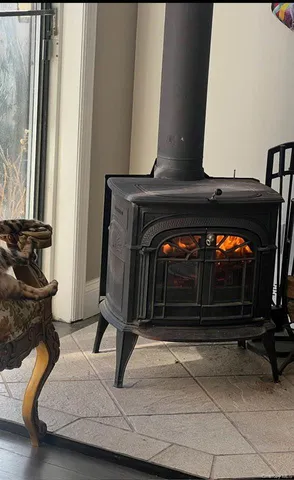 a view of room with wooden floor and gym equipment