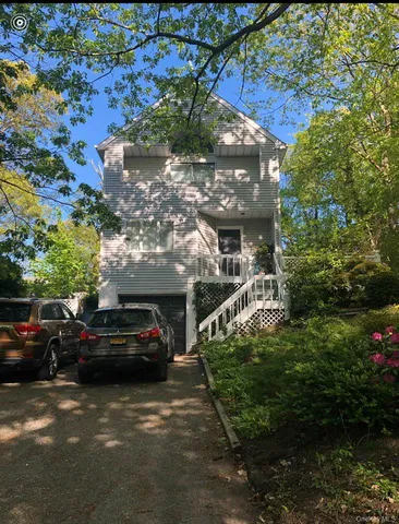 a view of a yard in front of retail shops