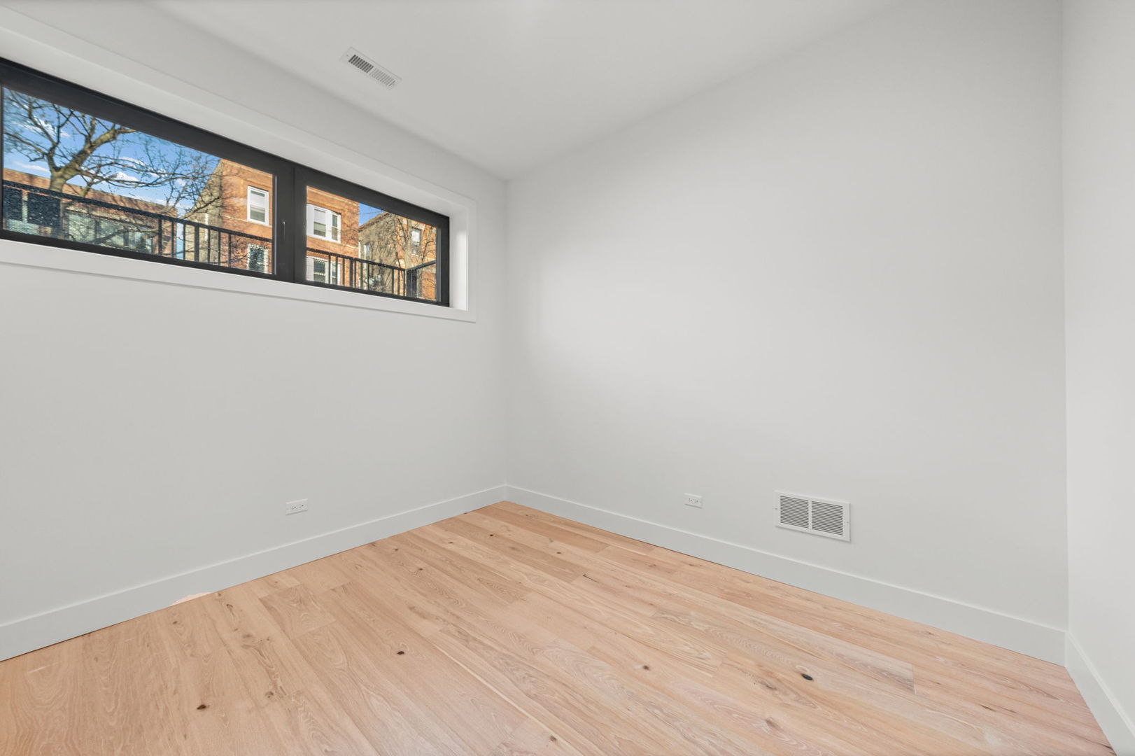 2341 West Belden Avenue, Unit 1 Chicago, IL 60647 - Photo 12 of 24 a view of a hallway with wooden floor and a window