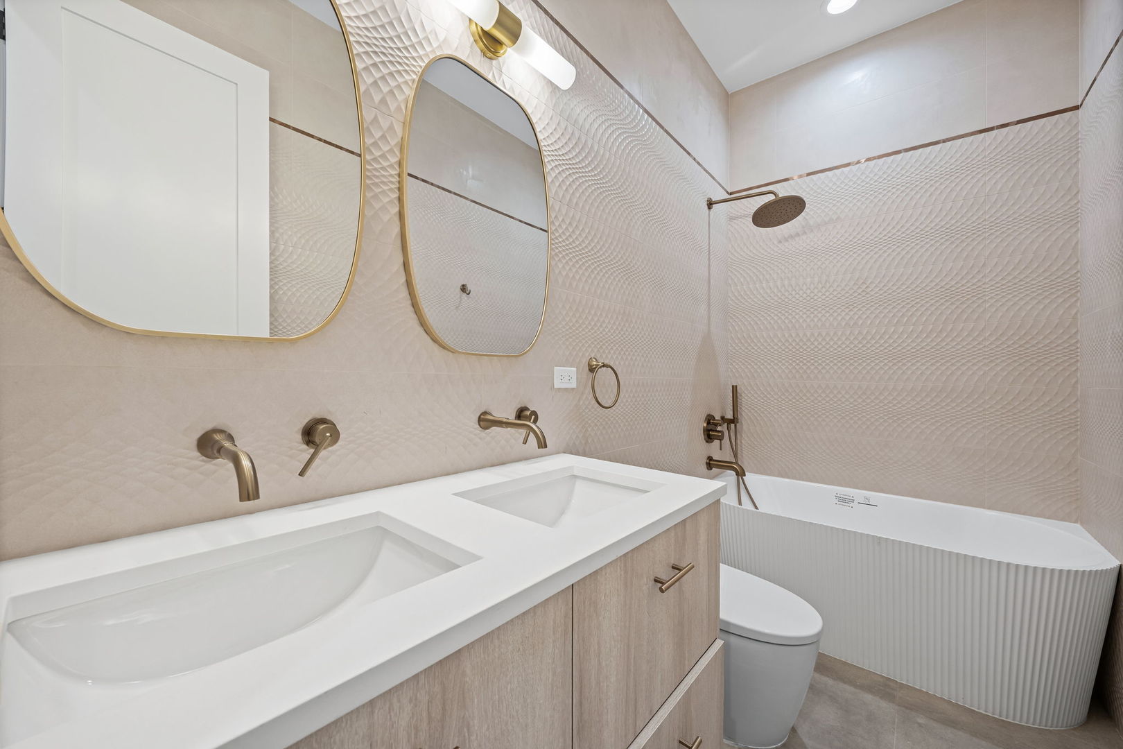 2341 West Belden Avenue, Unit 1 Chicago, IL 60647 - Photo 14 of 24 a bathroom with a sink and a mirror