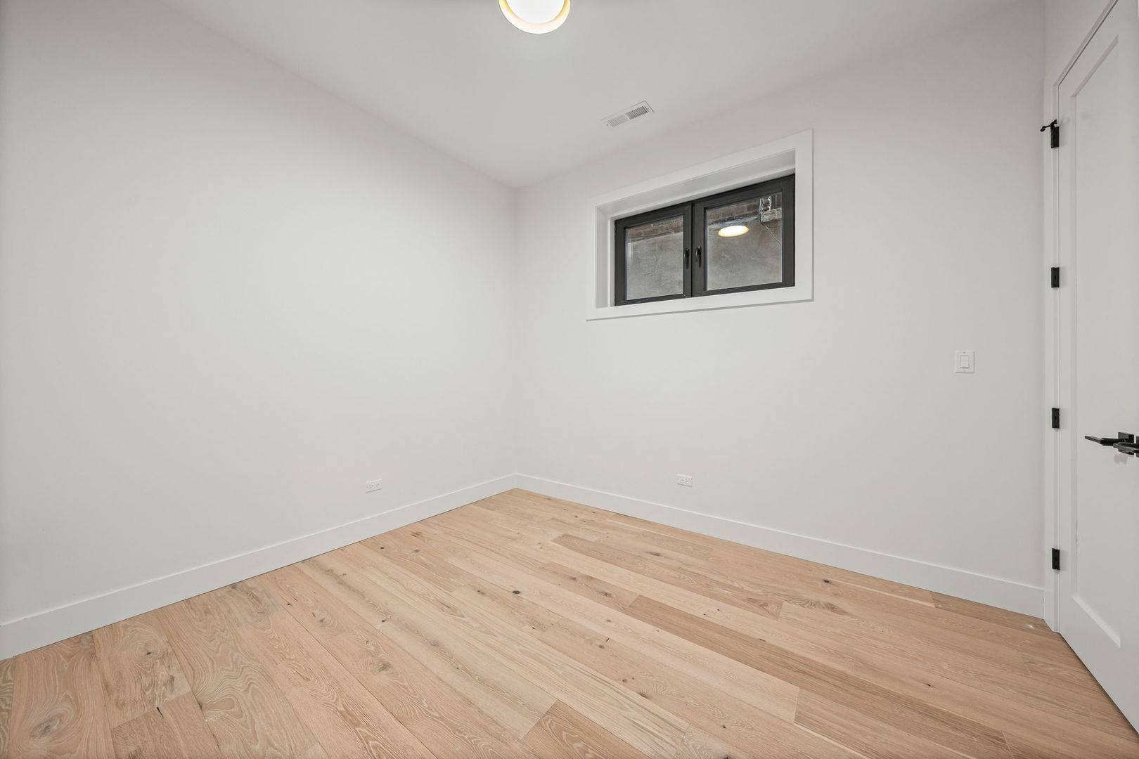 2341 West Belden Avenue, Unit 1 Chicago, IL 60647 - Photo 15 of 24 wooden floor in a empty room