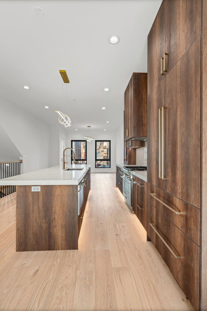 2341 West Belden Avenue, Unit 1 Chicago, IL 60647 - Photo 5 of 24 a view of kitchen with wooden floor and electronic appliances