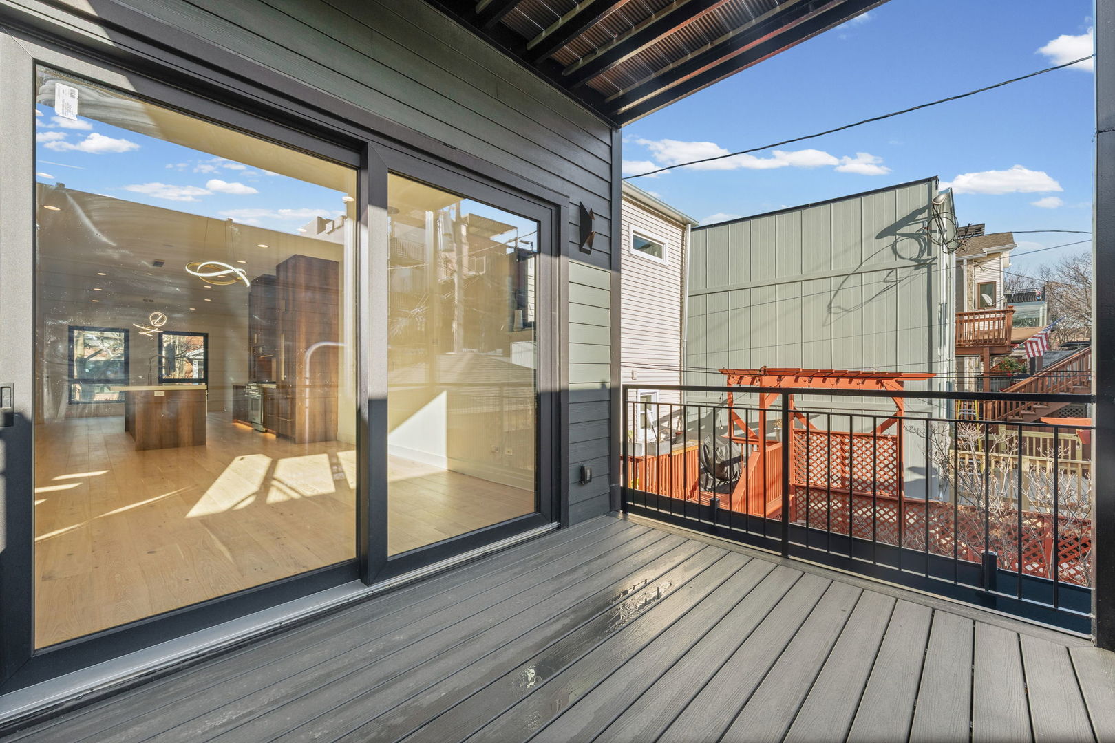 2341 West Belden Avenue, Unit 1 Chicago, IL 60647 - Photo 10 of 24 a view of a balcony with wooden floor and furniture