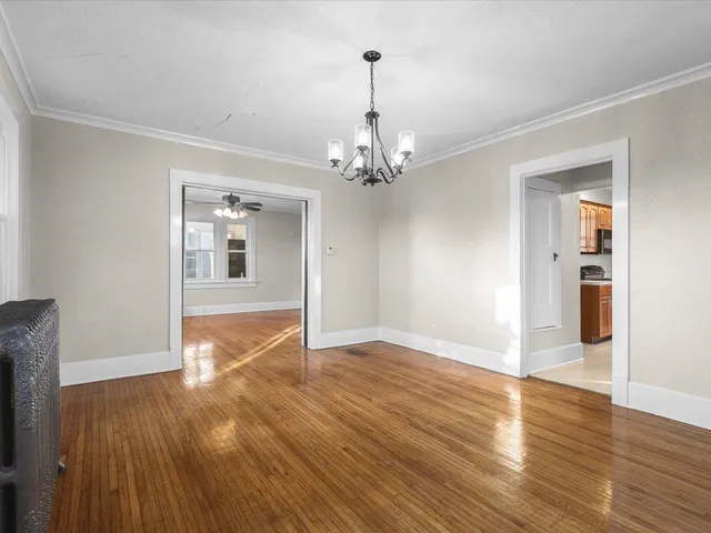 a view of a livingroom with wooden floor