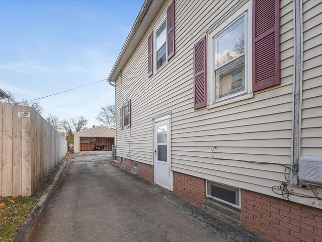 a view of a house with a street