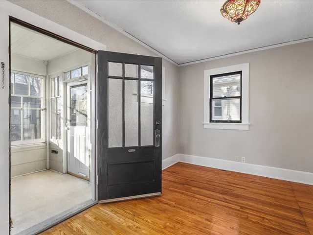 a view of room with window and hardwood floor