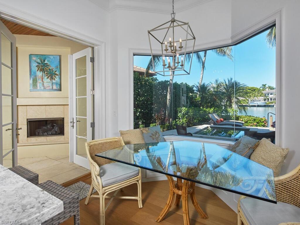 377 Pirates Bight Naples, FL 34103 - Photo 16 of 44 a view of a dining room with furniture window and outside view