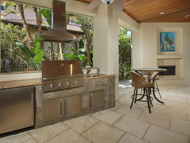 a kitchen with a sink and a stove top oven