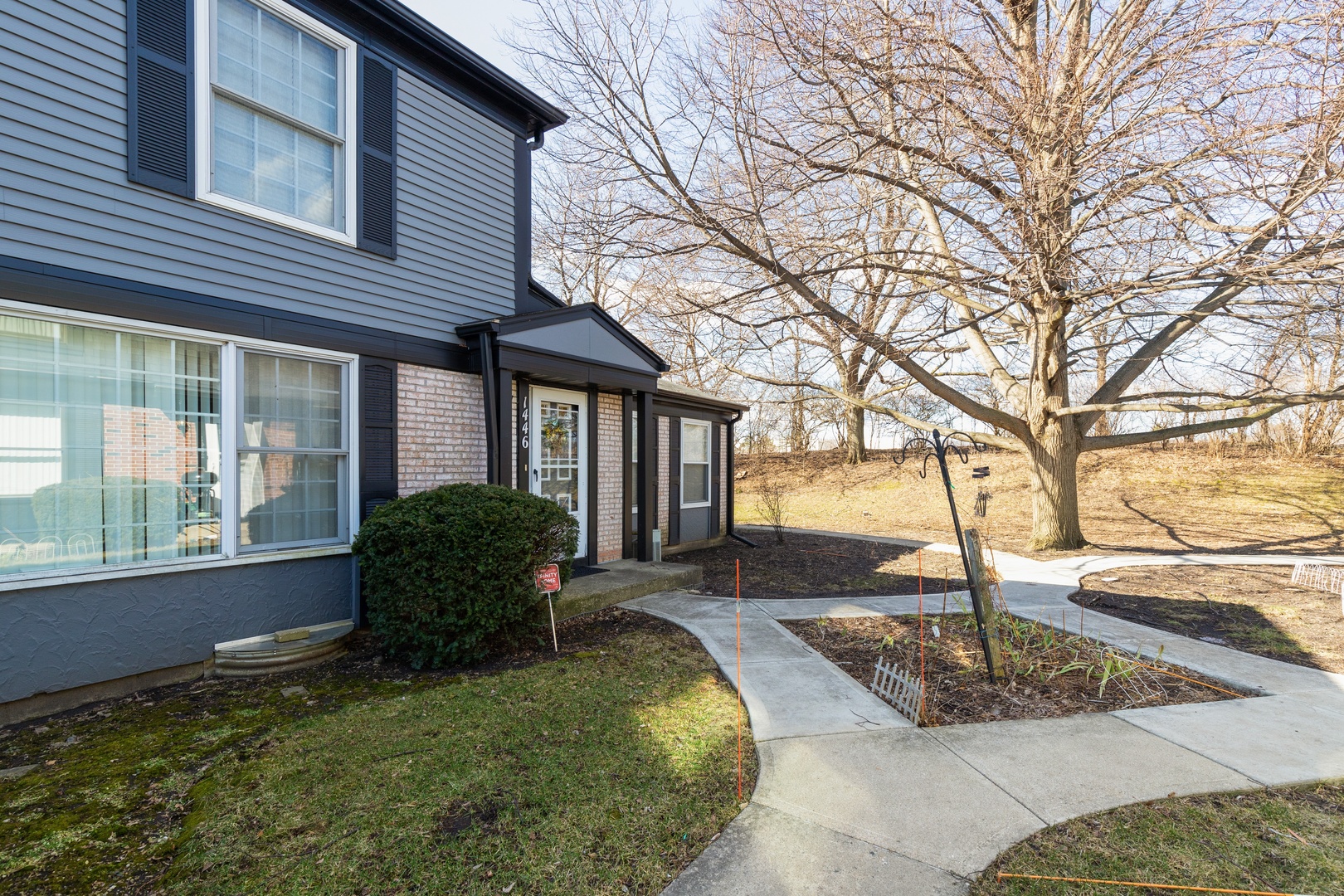 a front view of a house with garden