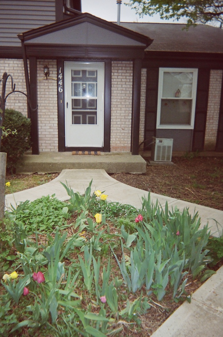 1446 Inverrary Lane, Unit 1446 Deerfield, IL 60015 - Photo 2 of 13 a front view of a house
