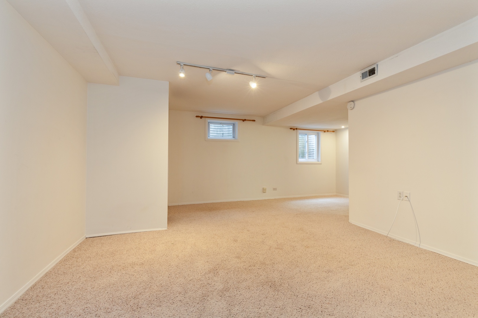1446 Inverrary Lane, Unit 1446 Deerfield, IL 60015 - Photo 11 of 13 an empty room with windows and closet
