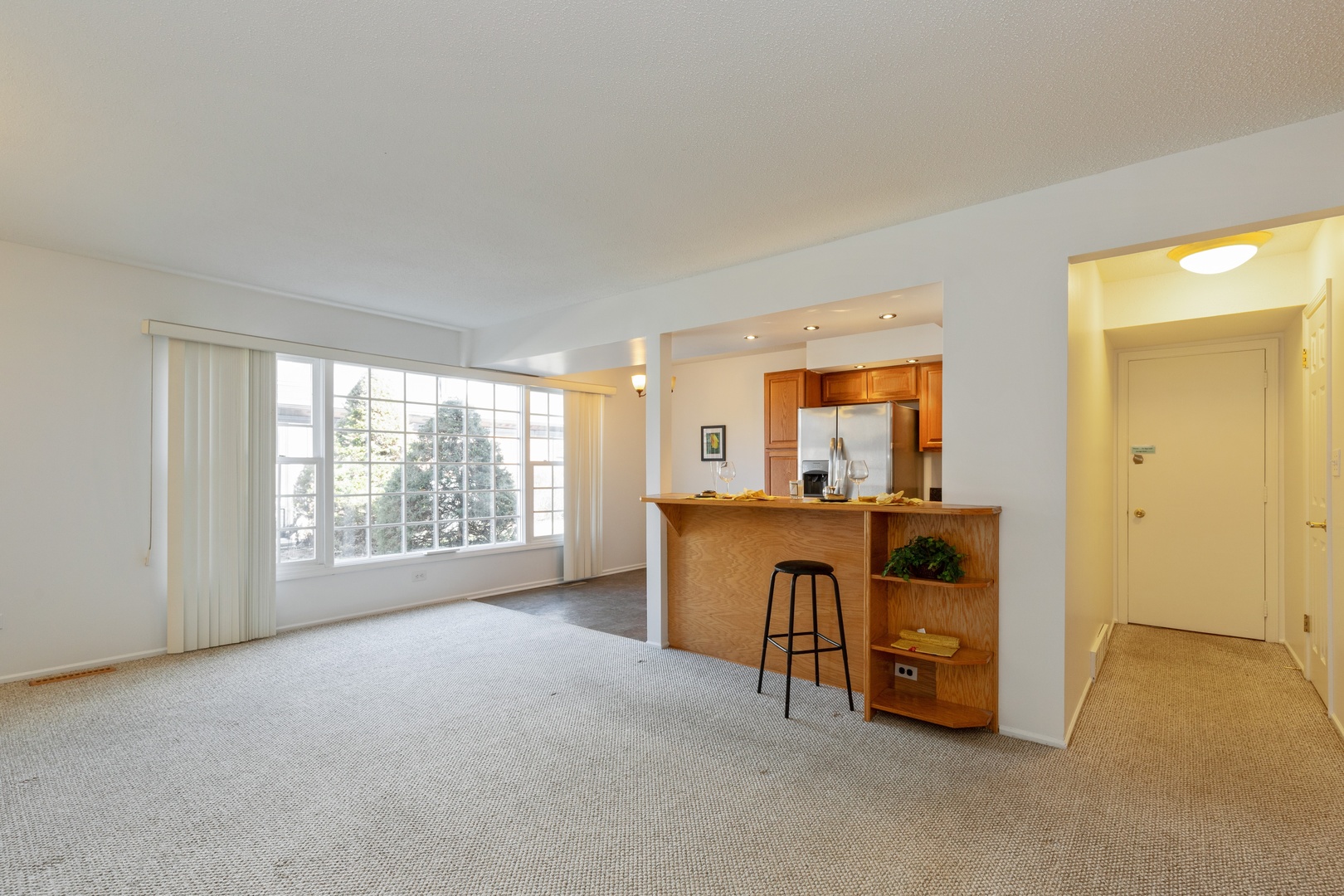 1446 Inverrary Lane, Unit 1446 Deerfield, IL 60015 - Photo 4 of 13 a view of workspace with furniture and a window