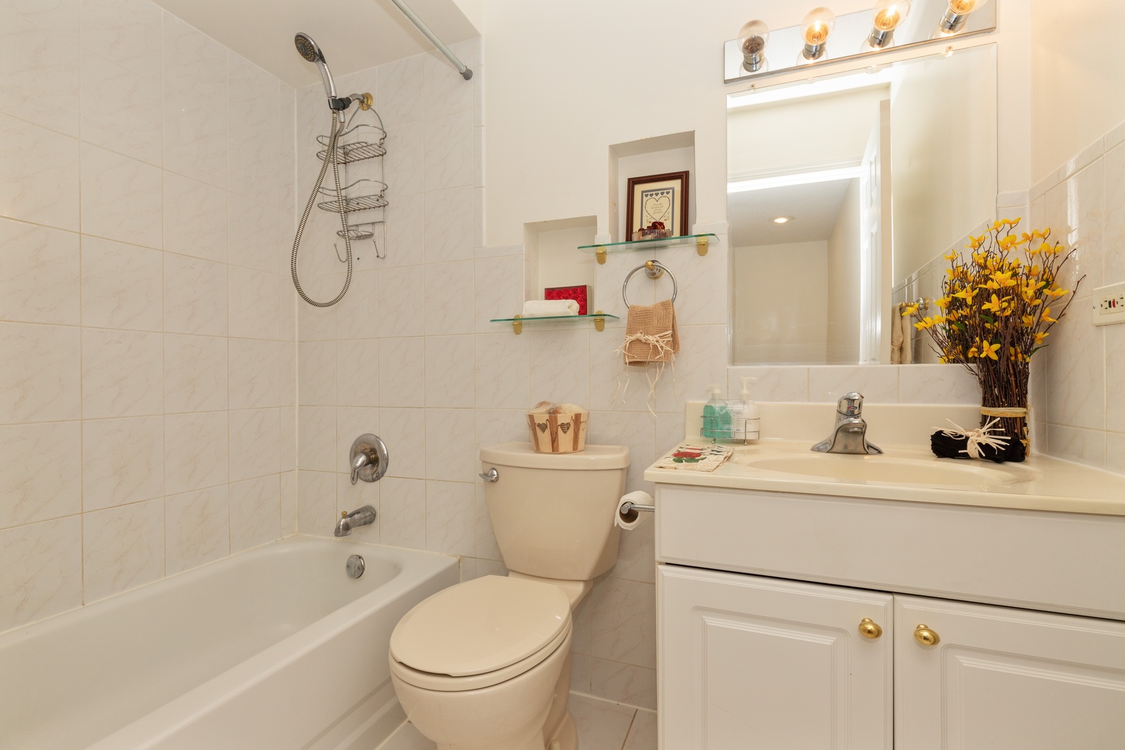 1446 Inverrary Lane, Unit 1446 Deerfield, IL 60015 - Photo 10 of 13 a bathroom with a sink vanity mirror and toilet