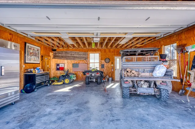 a view of living room kitchen and entryway