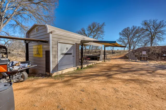 a view of a house with sitting area and roof deck