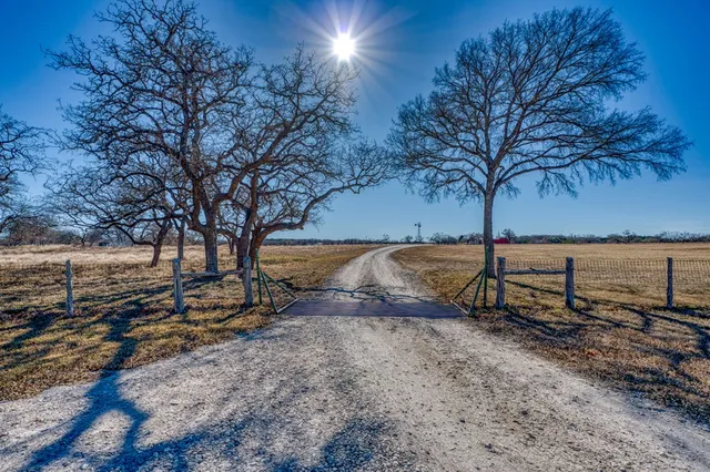 a view of a street with an ocean view
